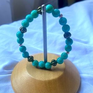 Blue and gold beaded bracelet. Stretchy.